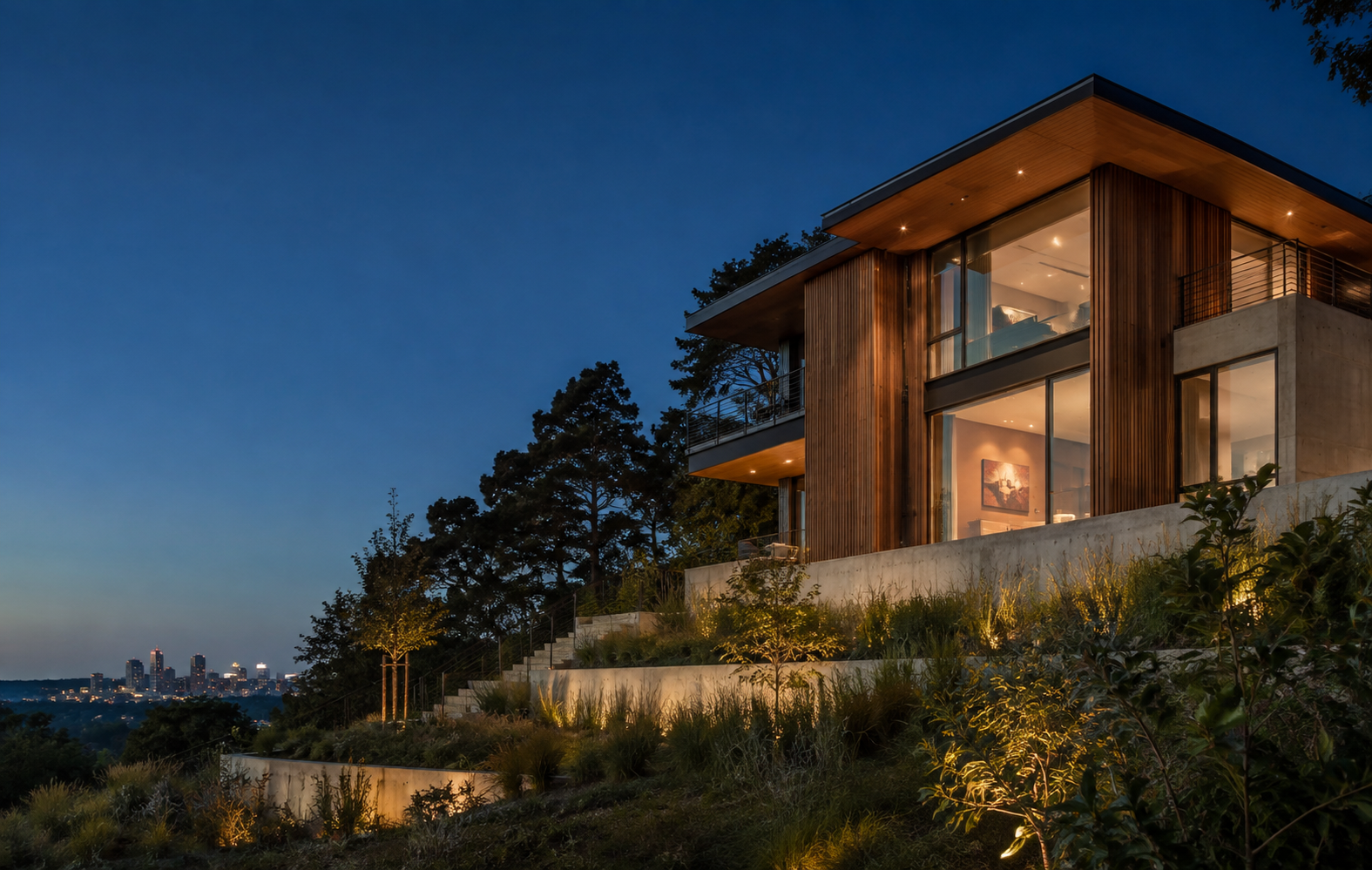 Contemporary building with cedar cladding and native landscaping at dusk